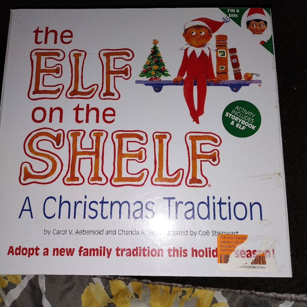 New elf on a shelf with book